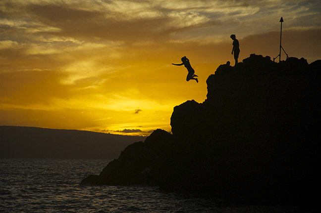 Cliff jumping at sunset rock